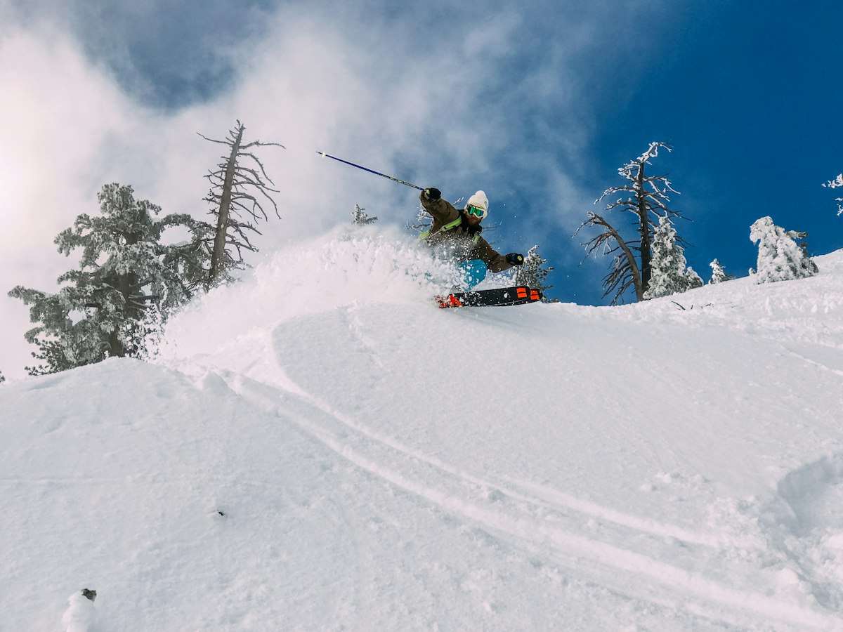 Skier spraying fresh powder snow